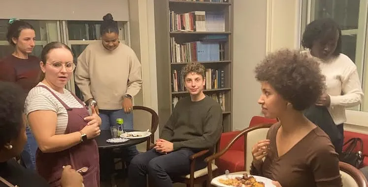 Graduate students gathered at Africa house.